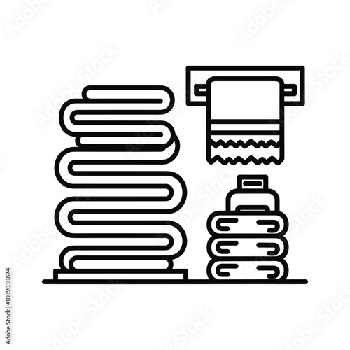 Stack of towels and hanging towel isolated on