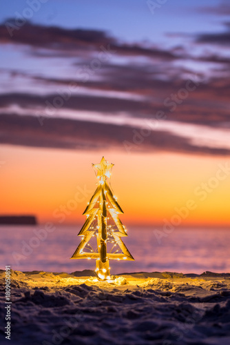 Illuminated Christmas Tree on a beach in summer