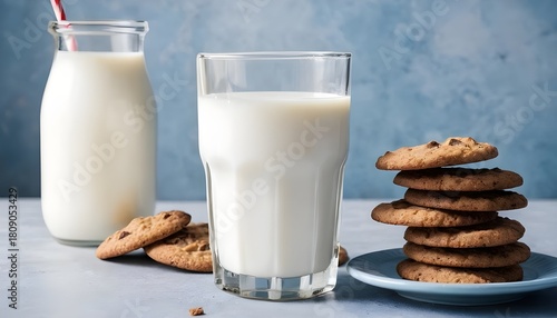 Fresh milk glasses with cookies on rustic table
