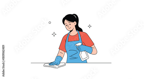 Happy woman in an apron and gloves is cleaning a surface with a spray bottle and cloth as part of her household chores.