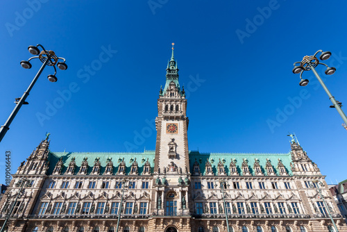 Hamburg City Hall in Germany, a grand Neo-Renaissance building with its prominent tower and intricate facade under a clear blue sky