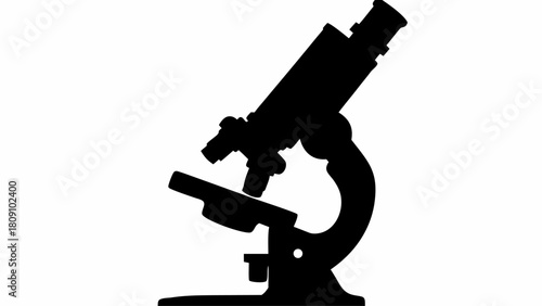 Silhouette of a laboratory microscope used for scientific research and experimentation in black and white