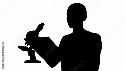 Silhouette of a person using a microscope and taking notes on a clipboard in a laboratory setting