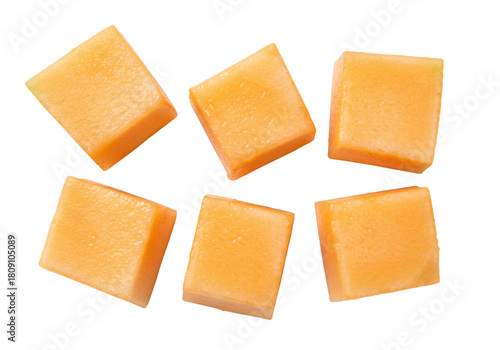 Photos Isolated cubes of cantaloupe, cut and ready to eat, refreshing orange melon piec