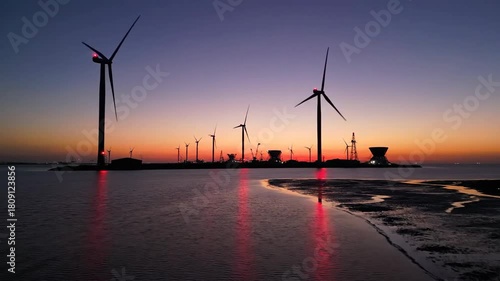 Wallpaper Mural Wind turbines at sunset on the water generating clean energy. Torontodigital.ca