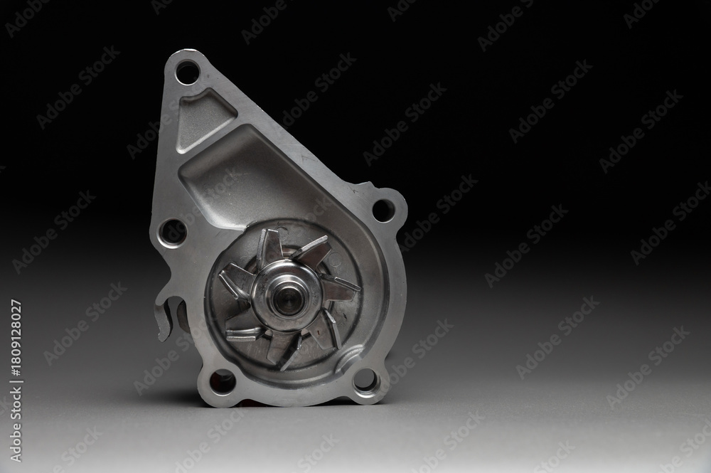 Obraz premium New spare part on a gradient gray background7 Internal combustion engine cooling system pump
