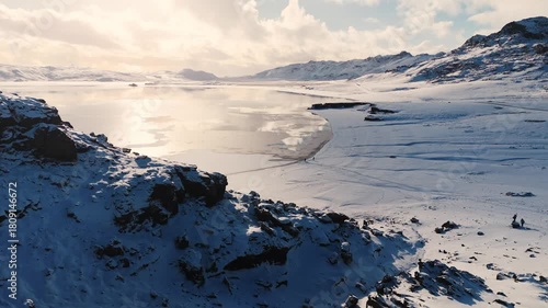 Wallpaper Mural Aerial footage of beautiful snow capped mountain cliffs and lake sunset landscape  Torontodigital.ca