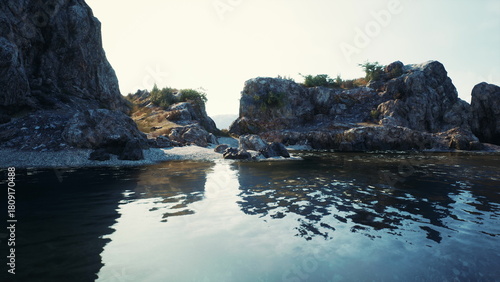 A mesmerizing body of water, framed by large rocks, along the scenic South African coastline.