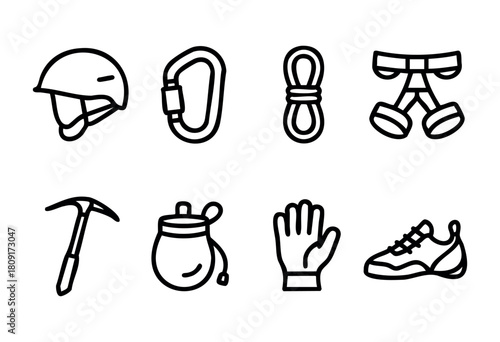 A collection of climbing equipment shows a helmet, rope, harness, carabiner, ice axe, chalk bag, climbing shoes, and a glove. These items are vital for safe rock climbing activities.