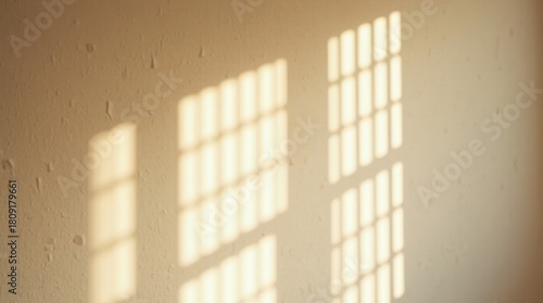 Wallpaper Mural Window light patterns cast on a beige wall creating an abstract and minimalist composition Torontodigital.ca