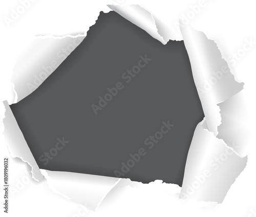 Torn white paper revealing dark gray background concept