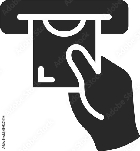 Hand inserting bank card into ATM slot