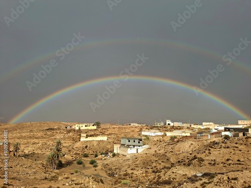 Double rainbow over a rural desert village in Tunisia
