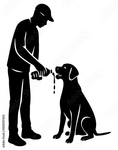 Silhouette of man giving water to seated dog