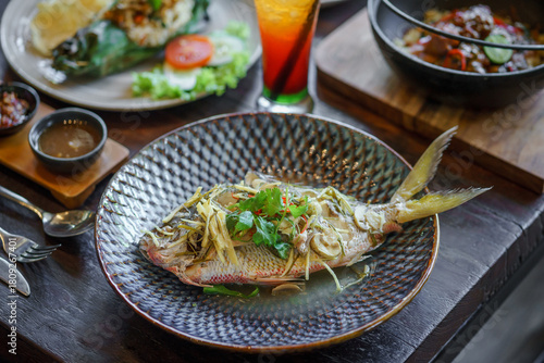 Steamed fish served on the table.