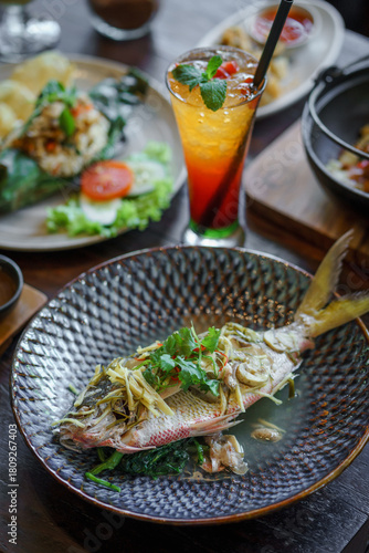 Steamed fish served on the table.