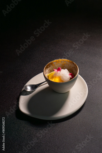 Coffee chocolate dessert with foam sauce is served on the table.