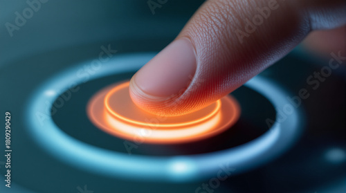 Finger Initiates Activation: Close-up of a finger poised to activate a futuristic glowing button, embodying the concept of starting, power, and high-tech interface.