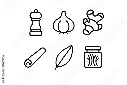 Essential culinary spices and seasonings including garlic, ginger, cinnamon, and bay leaf
