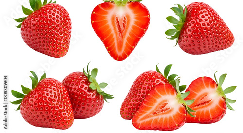 Fresh red strawberries, whole and sliced, with green leaves, isolated on transparent background