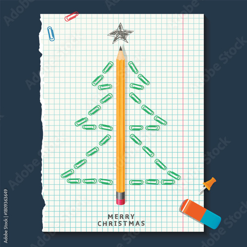Christmas tree made with pencil and paper clips on notebook sheet