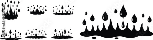 Black ink splatters and drops on white background