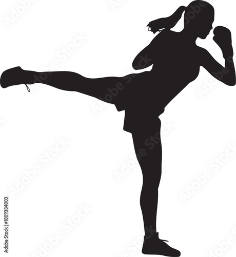 Silhouette of a woman practicing martial arts with a high kick and boxing stance