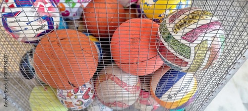 Colorful Sports Balls in Metal Storage Cage