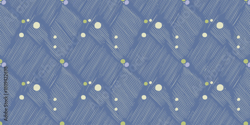 A repeating pattern of blue diamonds with white lines and scattered circles of green and cream colors