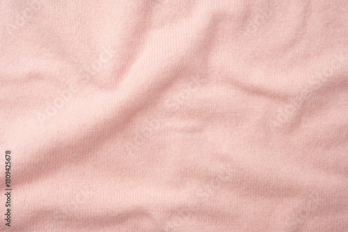 Soft pink cashmere sweater texture background.