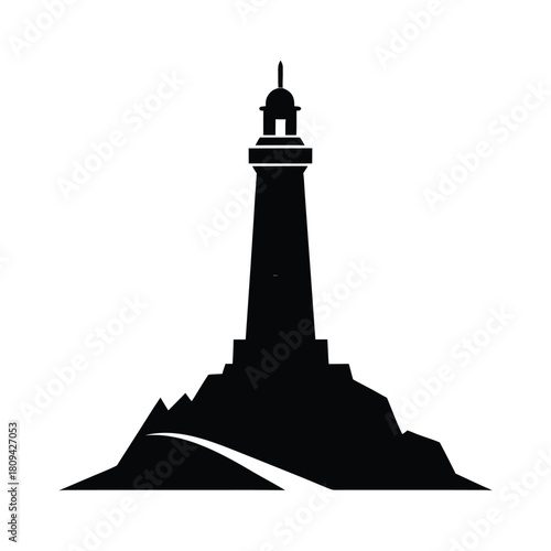Silhouette of a lighthouse on a rocky outcrop beacon