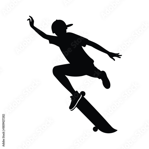Silhouette of a skateboarder performing a trick skateboarding