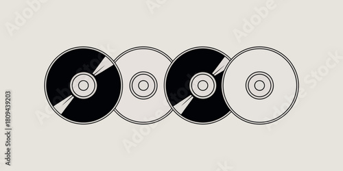 Row of vintage compact discs with black and white designs