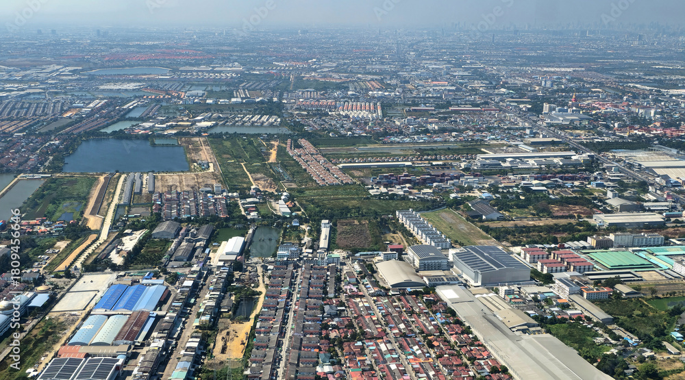 Fototapeta premium Aerial view of Bang Phli cityscape and aquaculture farms in Samut Prakan, Thailand, Southeast Asia.