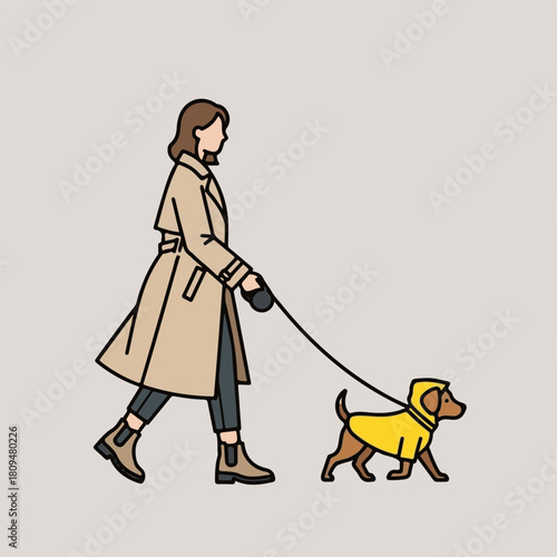 Woman walking dog on leash, stroll portrays dog and human companionship in neutral colors. Woman walking dog in coat with dog wearing matching yellow rain jacket.
