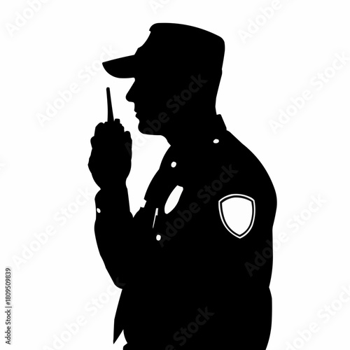 Silhouette of a Security Guard Communicating with a Walkie-Talkie.
