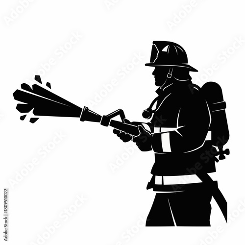 Firefighter in action spraying water with a powerful hose to extinguish flames.