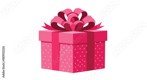 A lovely pink gift box decorated with a subtle polka dot pattern and wrapped with a large elaborate matching pink bow.