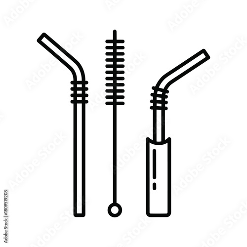 Reusable metal drinking straws with cleaning brush, isolated on