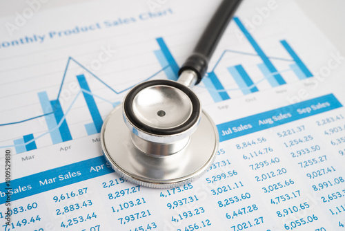 Stethoscope on chart or graph paper, Financial, account, statistics and business data medical health.