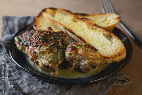 Baked chicken pieces in a creamy sauce with aromatic herbs