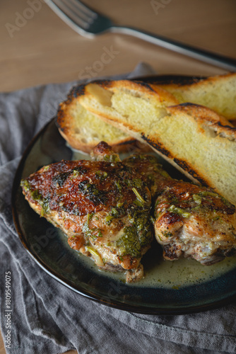 Baked chicken pieces in a creamy sauce with aromatic herbs