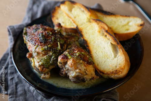 Baked chicken pieces in a creamy sauce with aromatic herbs