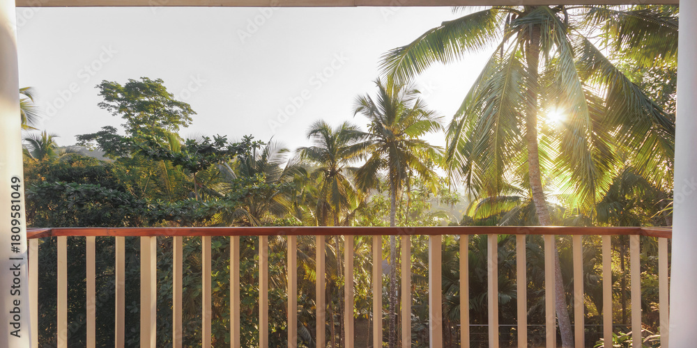 Obraz premium Sunlit Tropical Balcony With Jungle View And Coconut Palm Trees
