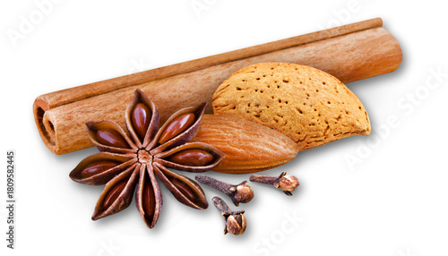 Cinnamon sticks, star anise, almonds and cloves with shadow on white background