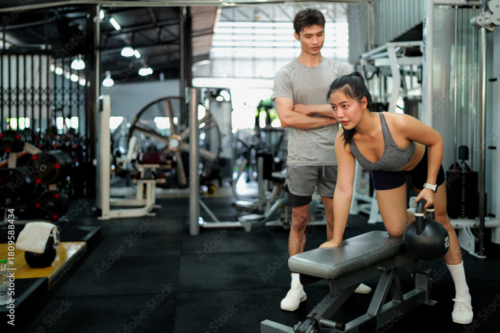 Fototapeta premium gym sport fitness exercise health woman weight training kettlebell trainer coach instructor personal equipment strong healthy fit active workout body man activity