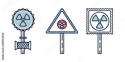 Three different radiation warning signs are displayed on poles.