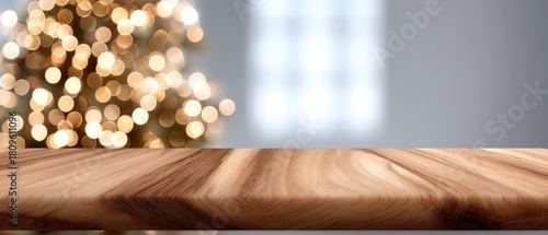 A warm and inviting space features a wooden table in front of a Christmas tree and large windows that bring in natural light during winter