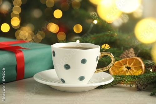 Wallpaper Mural Aromatic coffee and Christmas decor on white wooden table against blurred lights, closeup Torontodigital.ca