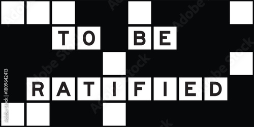 Alphabet letter in word to be ratififed on crossword puzzle background